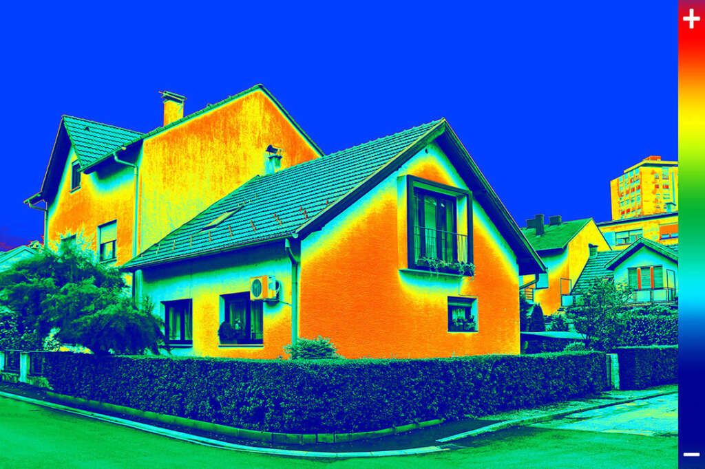 Infrared camera image of house showing energy leaks