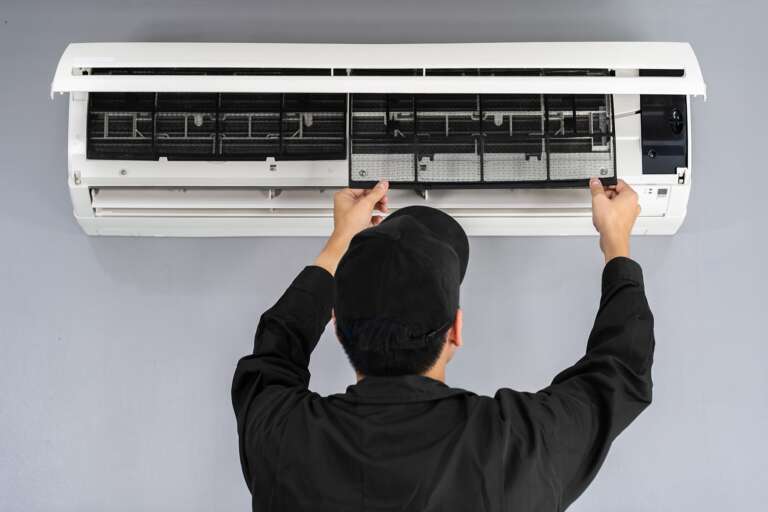Mini-Split installation example HVAC Tech works on a mini-split system